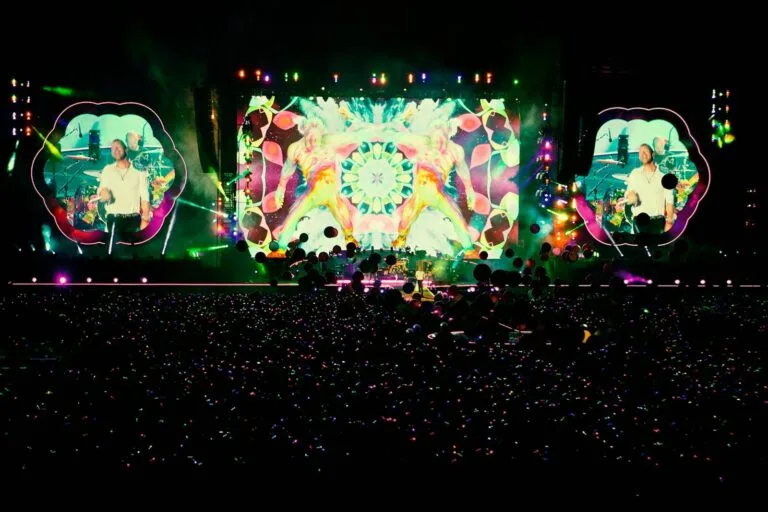 people standing in front of stage partying during nighttime