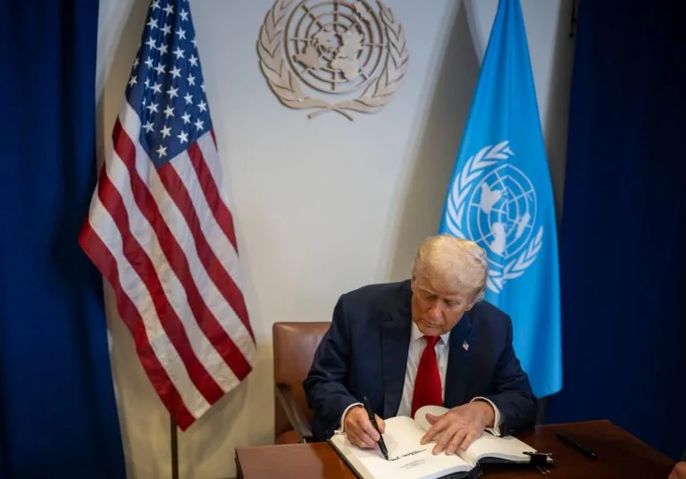 President Donald Trump signs the guest book at a bilateral meeting with U.N. Secretary General