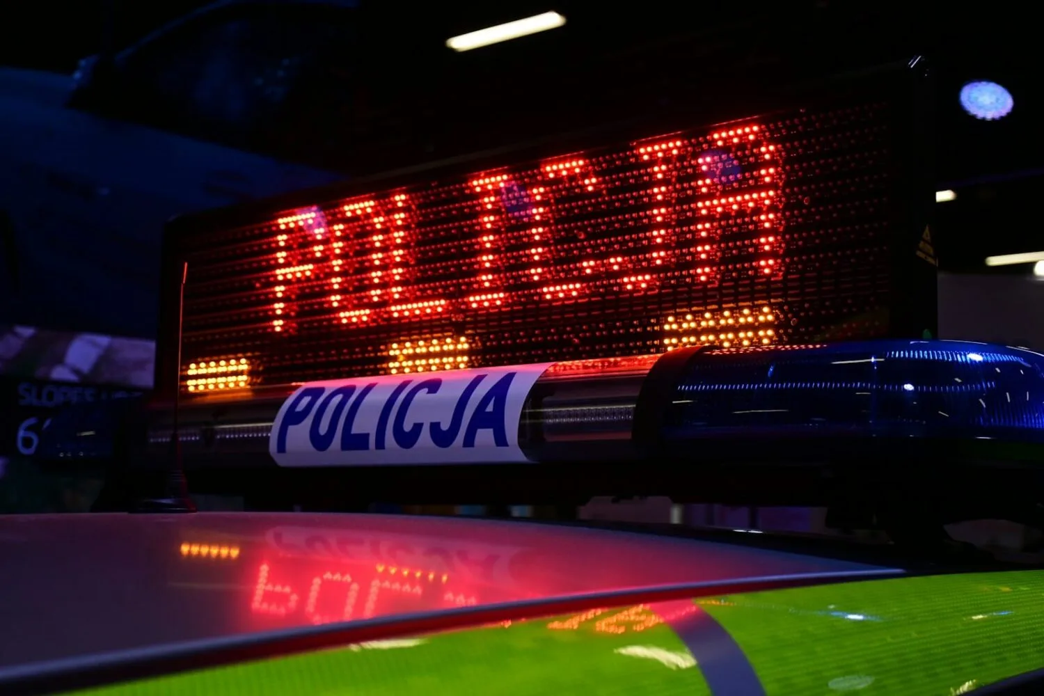 a close up of a police car sign